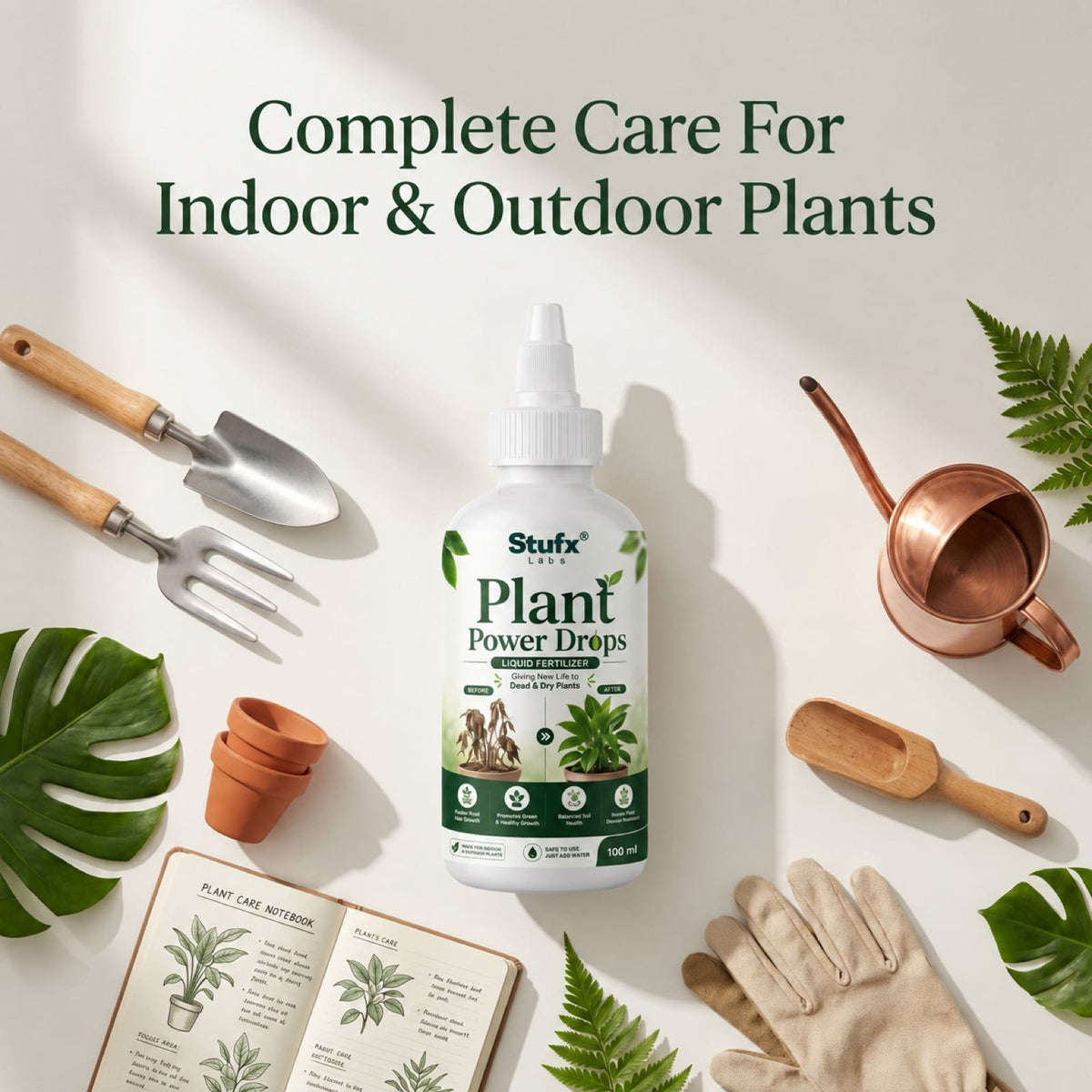 Plant Power Drops bottle surrounded by gardening tools, gloves and a watering can